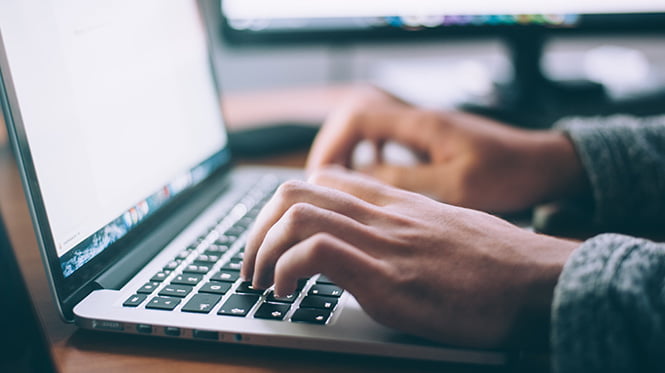 typing on laptop